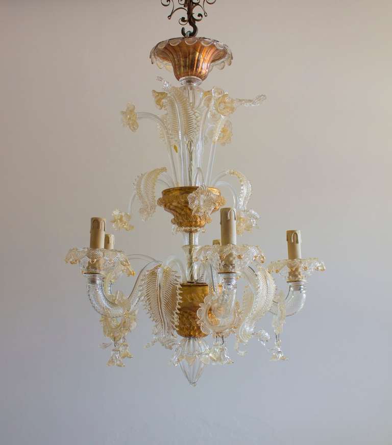Elegant Murano Gold chendelier with 5 lights, circa 1950's, attributed to Pauly and Company. The chandelier is 28 inches high, by 22 inches diameter. We can professionally rewire this item to your country's specifications.