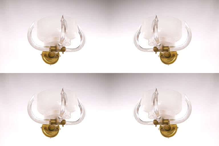 Amazing Italian  Pair of Sconces in blown Murano Glass White color,  Camer Glass, 1960s, constituted of a main huge white bowl, surrendered by three Triedro curved, joined together by a massive original brass frame; inside each one there is one
