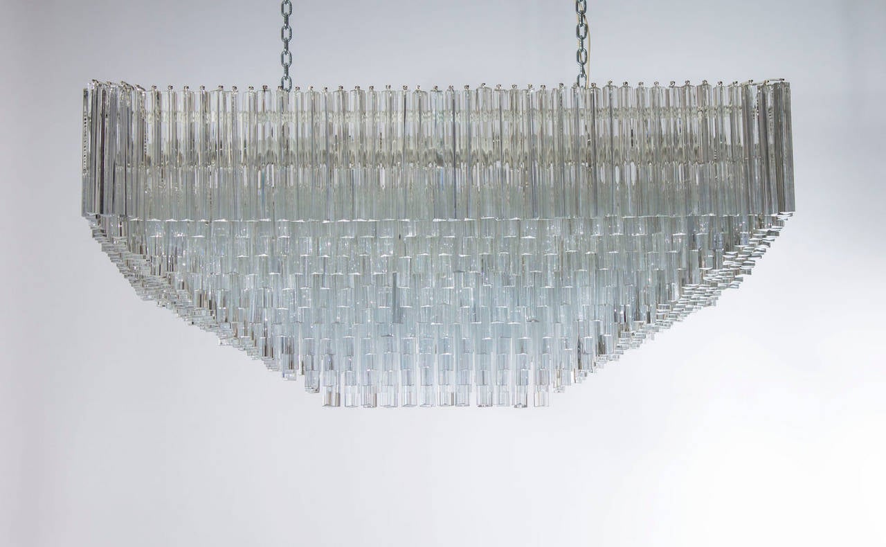 Massive, astonished, and elegant Italian Venetian flush mount, blown Murano glass, in a beautiful rectangular shape composed by transparent triedro elements entirely manufactured in blown Murano glass, accommodated in its original white vintage