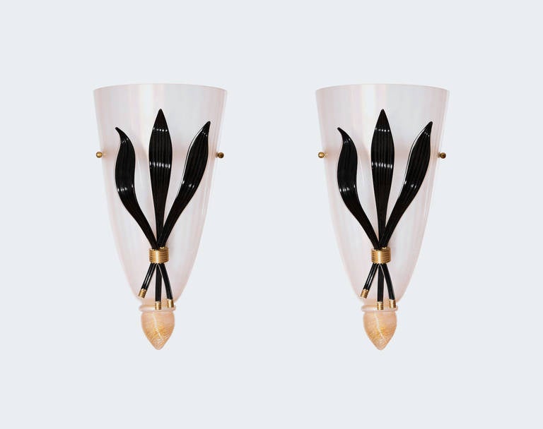 Italian Venetian Sconces, Blown Murano Glass, Black Gold White, Deco, 1980s.
Pair of amazing and beautiful Italian Venetian in blown Murano glass deco sconces, composed by a white and gold vase sandblasted, with on the top a gold submerged drop, and