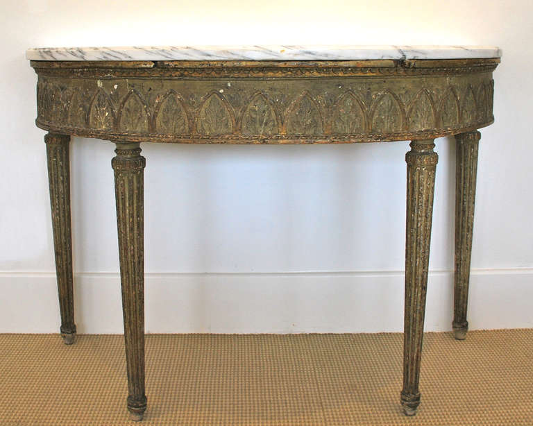 18th century console, elongated, fluted legs, with raised panel of arch motif.