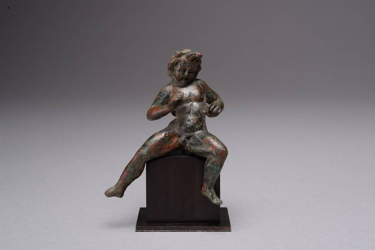 An ancient Greek or early Roman Hellenistic figure of a satyr, dating to circa 100 BC.

A particularly fine example of an interesting and energetic scene, this stunning Hellenistic bronze rises well above the majority of Greek and Roman figures