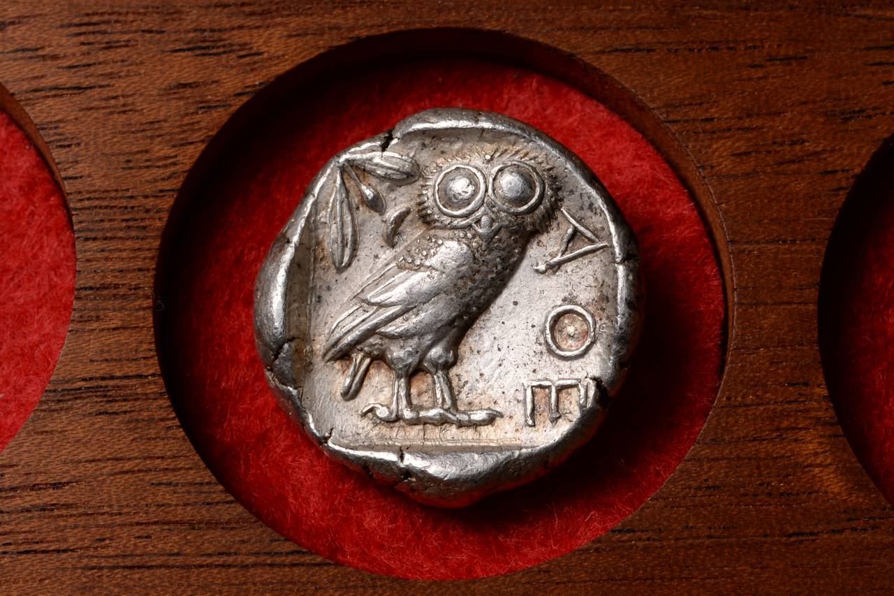 An extremely pleasing example of one of the most iconic and important coin types from the ancient world. A solid silver ancient Greek tetradrachm from Athens, struck circa 454 - 404 BC.

The obverse (image ii) depicts the head of Athena (patron to