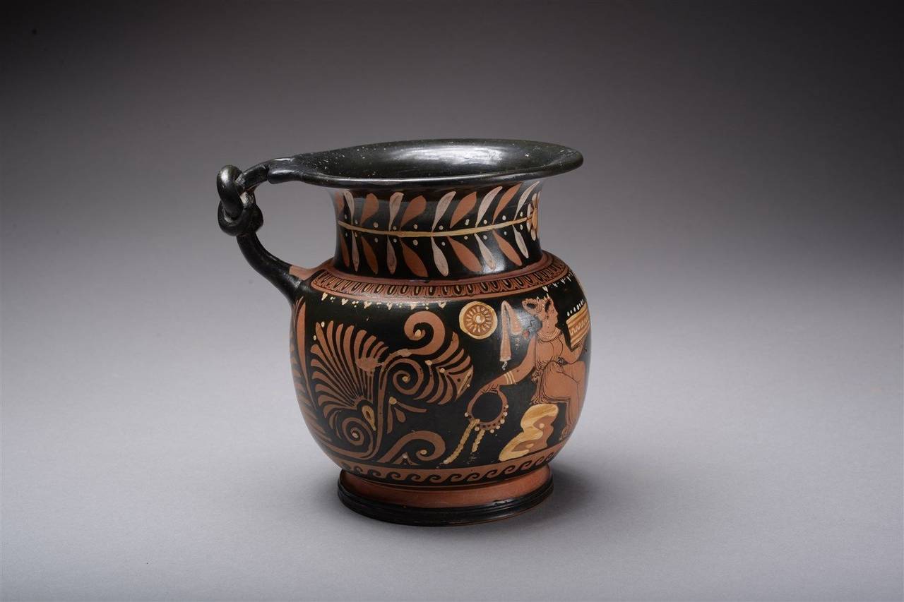 A stunning ancient Greek Apulian red-figure olpe, dating to the 4th century B.C.

This delicately potted, finely painted olpe (wine jug) is of typical Apulian form; with a ringed base, globular body, short neck and flaring mouth, an elaborate