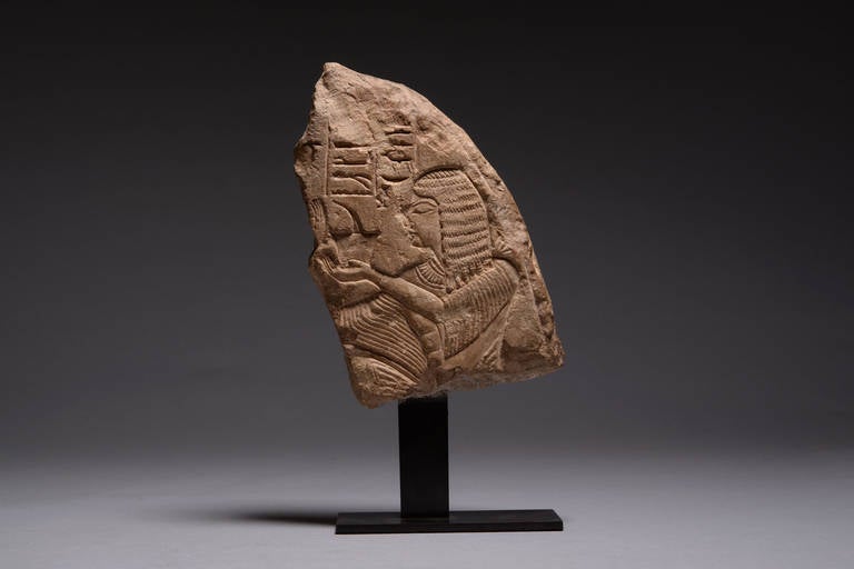 A fragment of an ancient Egyptian New Kingdom limestone stele, late 19th to 20th Dynasty, 1200 - 1077 BC.

This beautifully balanced composition reflects the ordered clarity of Egyptian art. The man on the right is shown in a formalized stance