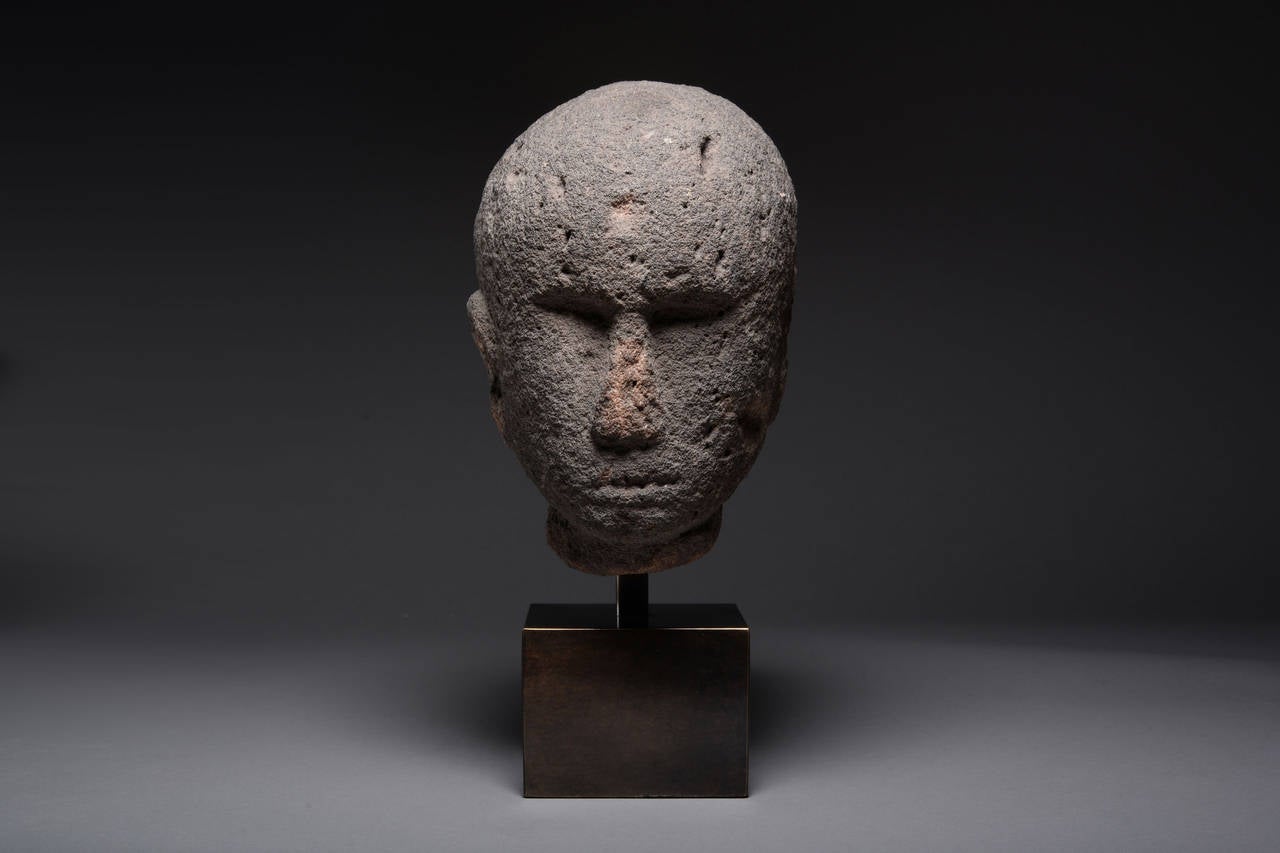 A striking ancient Celtic stone head, dating to the 1st century BC.

This imposing sculpture is of characteristically stylized form; carved with pronounced forehead, recessed eye sockets, triangular nose and slit mouth.

Stone carved heads such