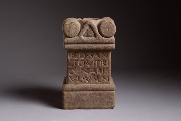 An extremely rare Roman stone votive altar, dedicated to the god Vitiris near the site of Hadrian’s Wall, likely dating to the 3rd century AD.

The altar of classic form, the inscription at the centre, the head embellished with two cylindrical