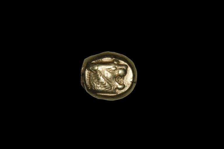 A truly fascinating and remarkable object; one of the very earliest coins ever minted. Struck from a weighty piece of electrum, a naturally occurring alloy of gold and silver, by the Lydian King Alyattes, circa 610 - 561 BC at the Sardes