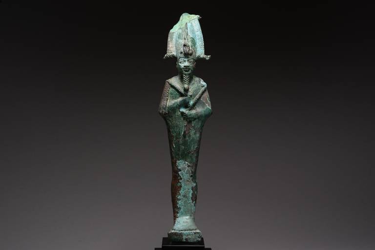A particularly large ancient Egyptian bronze figure of Osiris, dating to the Late Period, 664 – 332 BC.

The gently smiling figure represents Osiris, god of the afterlife, depicted bearded, mummiform and holding the crook and flail. He is