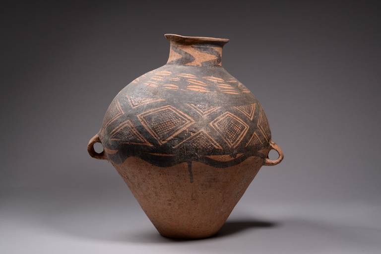 A genuine, large and decorative ancient Chinese Yangshao terracotta vase. Produced around 3000 BC, this remarkable piece dates to half a millennia before Chinese civilization first emerged from the mists of prehistory.

So-called Yangshao wares