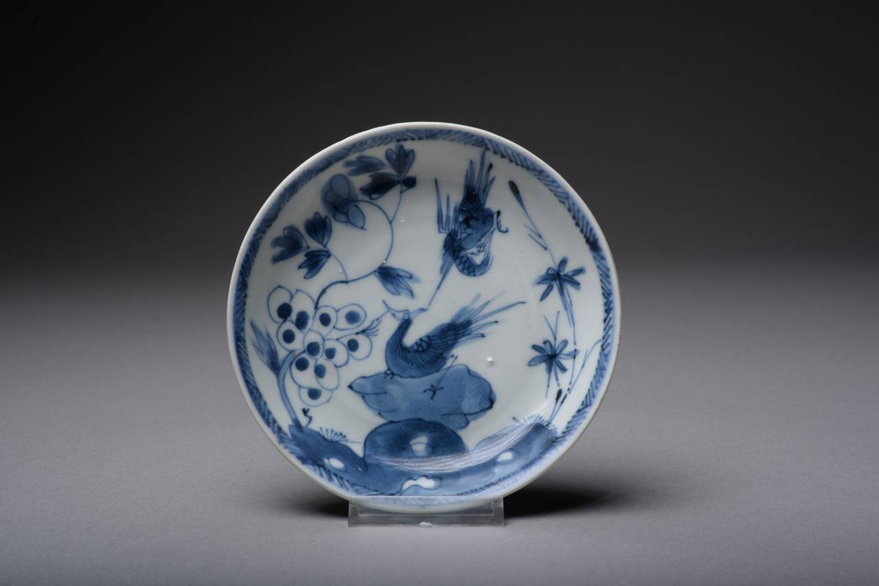 A wonderful, rare and vibrant Chinese blue on white porcelain plate dating to the Yongzheng period of China's Qing Dynasty (1723-1735), and salvaged from the Ca Mau shipwreck. An officially recorded piece with Ca Mau sticker and numbers.

The