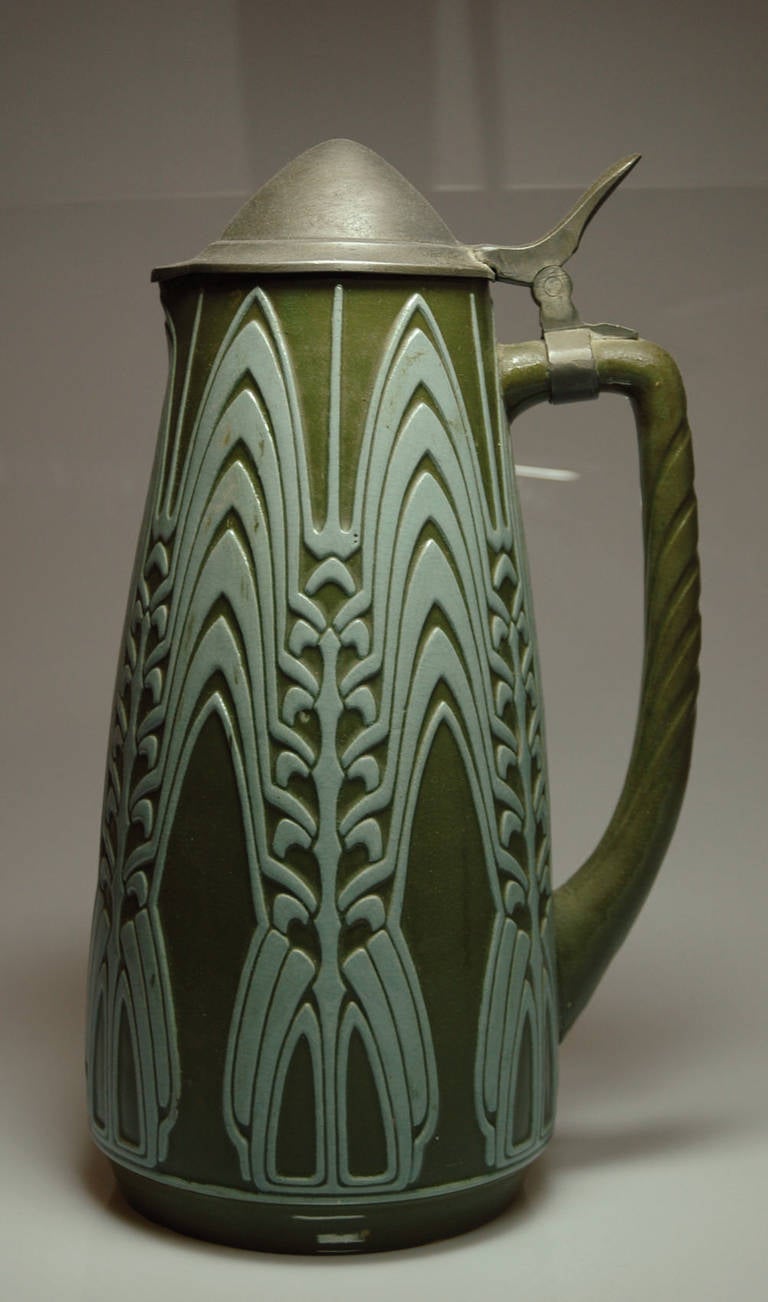 The stoneware pitcher from Peter Behrens is a good and rare sample for the German Jugendstil or Art nouveau beginning of the 20th century.

Literature: Die neue Ära 1900 - 1930 and Sothebys New York auction 14.12.2007 (lot 48, limit USD