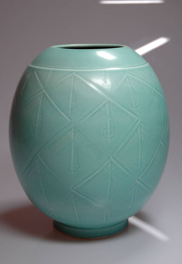 The denish artist Niels Thorsson creates already in the 30ths for Royal Kopenhagen, Aluminia many vases, which were influenced at first by the Art Decó. In the 1940s and 1950s he creates his important Marselis vases series. The vase Solbjerg is a