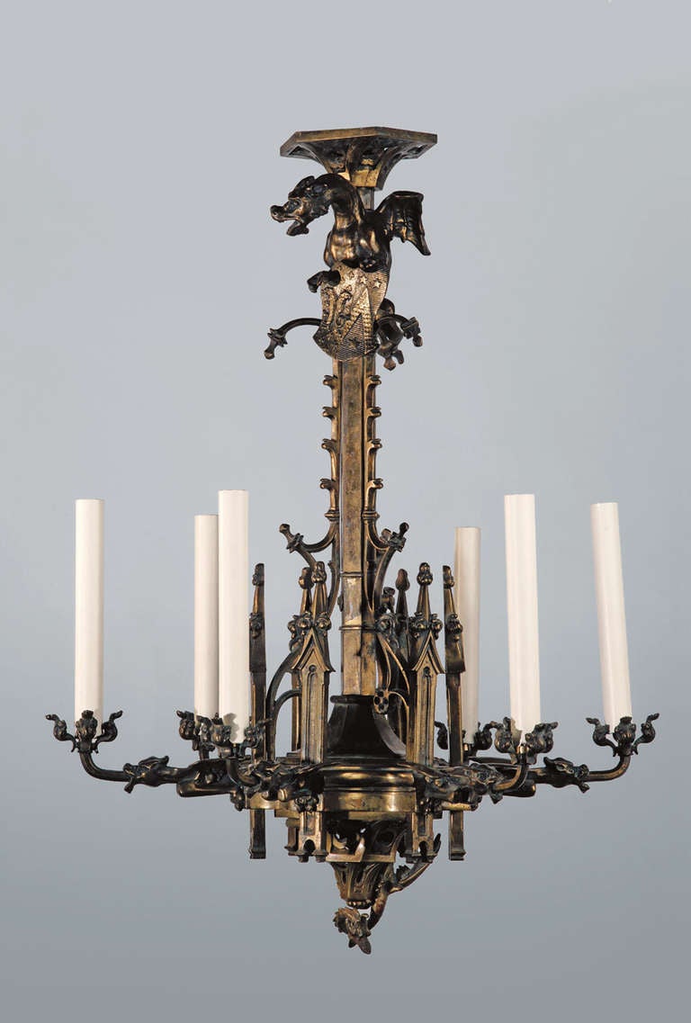 A Neo-Gothic chandelier with six arms of light forming gargoyles that are linked together with an architectural decoration of columns & towers. Initially created for gas.

The Neo-Gothic style is a 