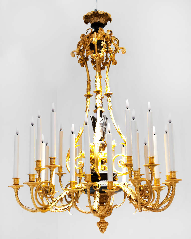 An important chandelier of Napoleon III period in the style of Louis XVI, with eight arms of light decorated with foliage holding twenty-eight lights on two levels. The central shaft is decorated with a neoclassical fire urn placed on a bouquet of