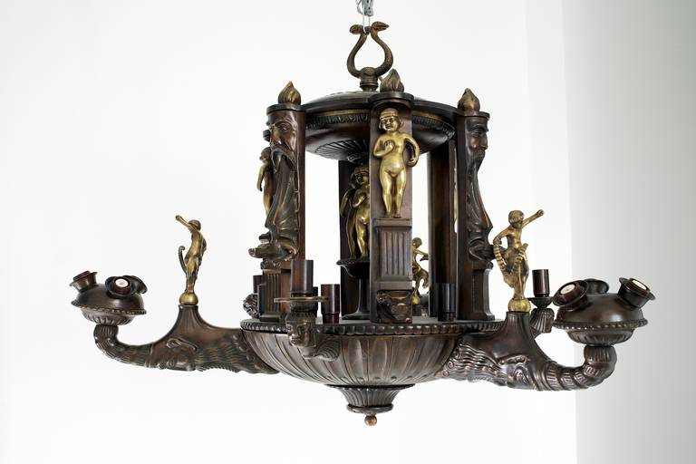 Chandelier with an eclectic decor of crocodiles, ibexes, snakes and Celtic deities.