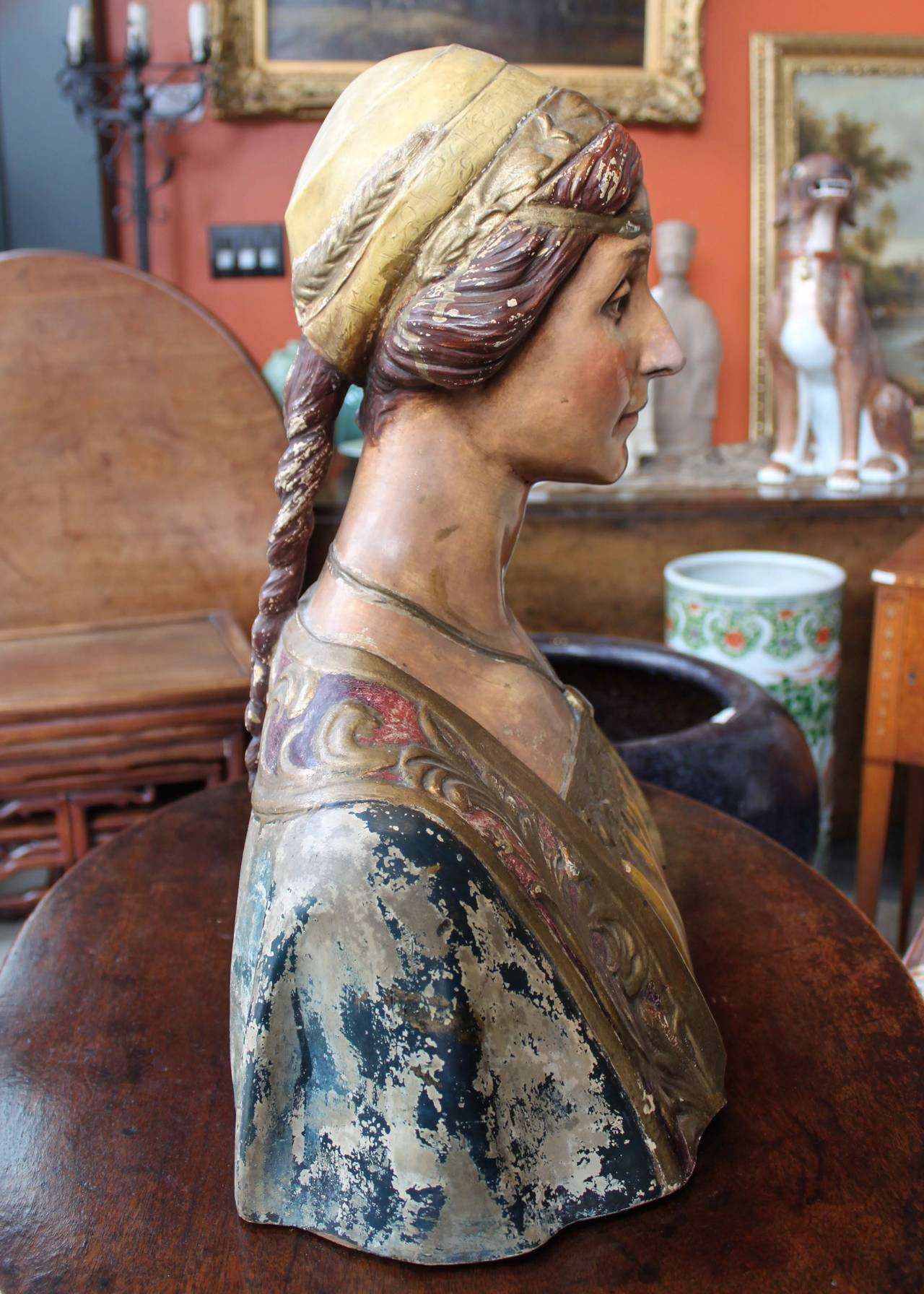 Antique terracotta bust of a Renaissance woman by and marked Dini & Cellai, an Italian sculptor during the 19th century. Original condition with hand-painted details rendered in a very realistic manner- an unusual and beautiful decorative piece.