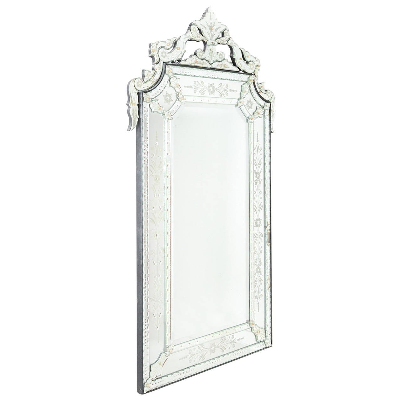 A beautiful early 20th century Venetian mirror. Some wear and minor imperfections (cracks) consistent with age.