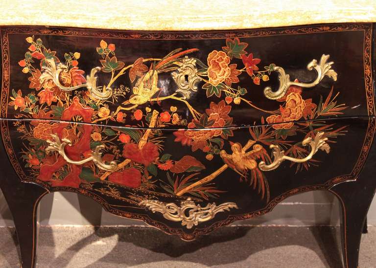 Ca. 1920 

A beautifully detailed French bombé commode with chinoiserie comprised of bamboo, bird and floral motifs. Original ebony finish, painted decoration on three sides and marble top. Two drawers.

48