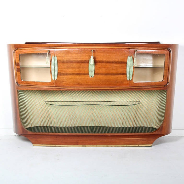 Circa 1955. Designed by Vittorio Dassi and manufactured by Dassi Fabbrica di Mobile, Italy. Rosewood, veneered woods, green and gold varnish, and glass combine to fabricate an exquisitely detailed piece.  The fabulous interior is textured with glass