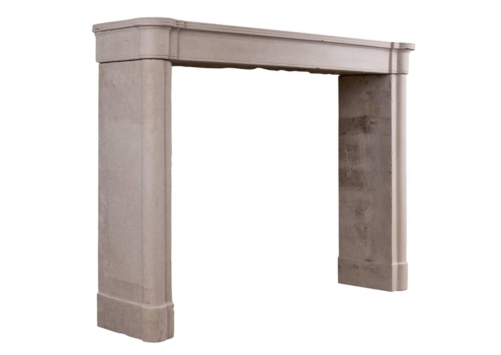 A small, well proportioned French stone Directoire fireplace. The jambs with half round columns surmounted by plain frieze and reeded shelf, circa 1800.

Measurements:
Shelf width: 1370 mm / 53 7/8 in
Overall height: 1005 mm / 39 5/8 in
Opening