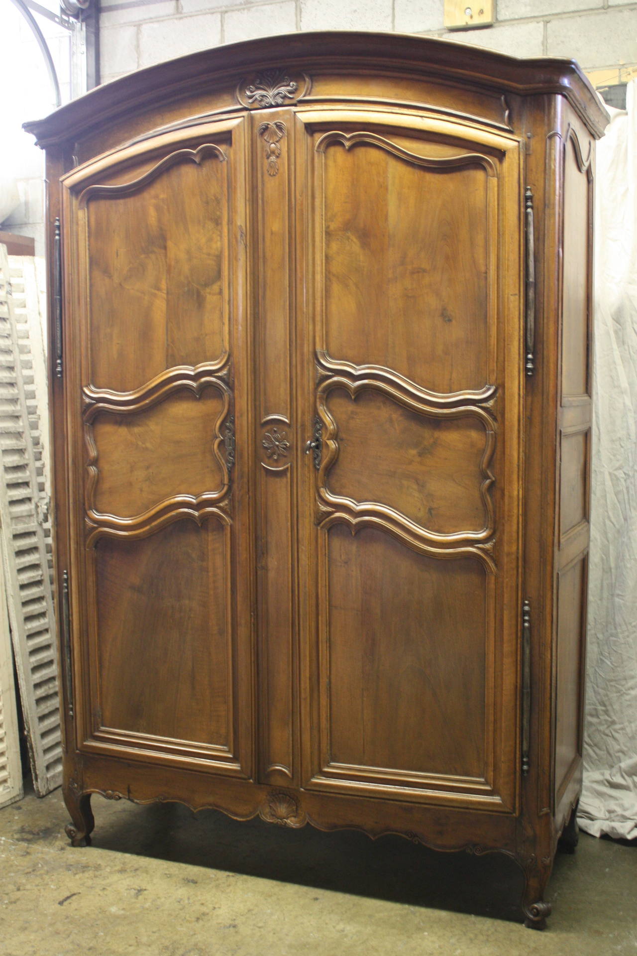 18th century French wardrobe, the wood is carved and made of walnut. Louis XV Period.