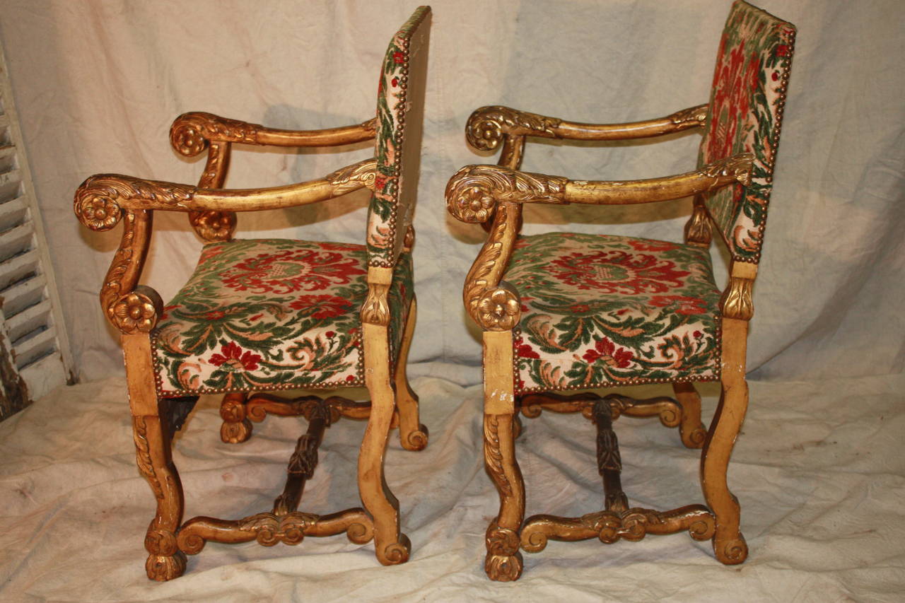 18th century Italian giltwood armchairs.