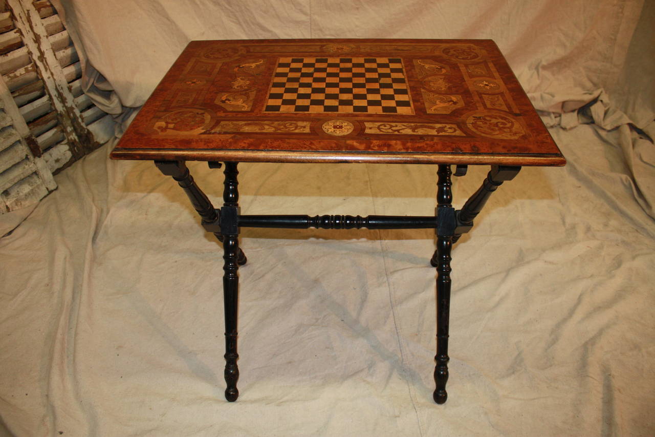 19th century French game table, inlay of different fruitwood, provenance, Paris, France.