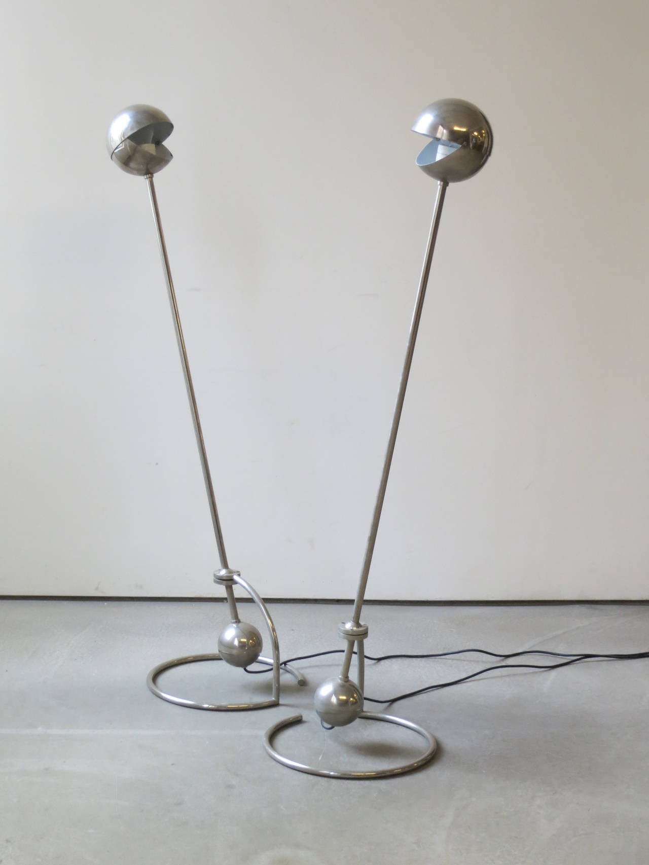 Pair of Desny Standing Lamps, by Woka, Designed 1920s. These standing lamps were designed in France in the 1920s by Desny and manufactured later by Woka in Austria. The top shade opens and closes, lighting forward or back. The upright frame pivots