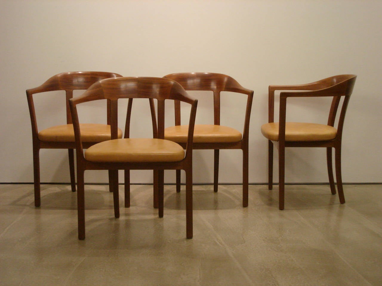 Ole Wanscher, Set of Four 1958 Armchairs in Mahogany and Original Leather Seats. 

Made by master cabinetmaker A.J. Iversen, Copenhagen.

Designed in 1958; these chairs date to circa 1958.
Mahogany with original natural leather upholstered