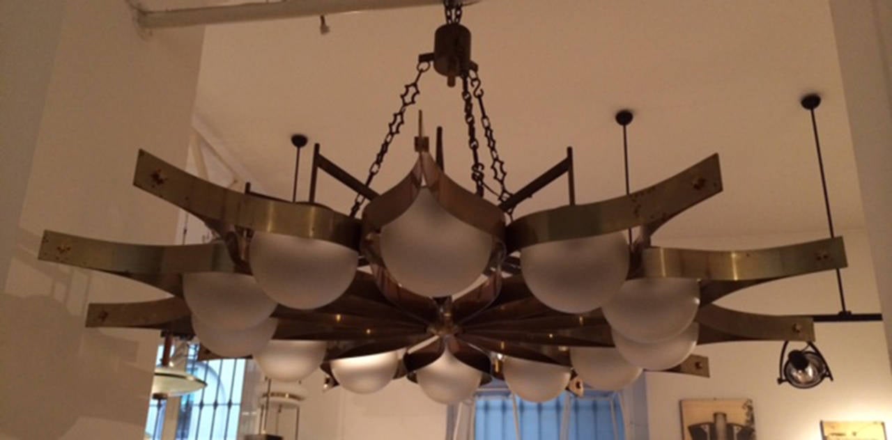 Very important and rare chandelier by Gio Ponti in massive brass with glass globes. Coming from a important restaurant in Bergamo (Italy). There are only four pieces produced. Details are luxurious, bolts are in form of stars. Circa 1960.
Evaluated