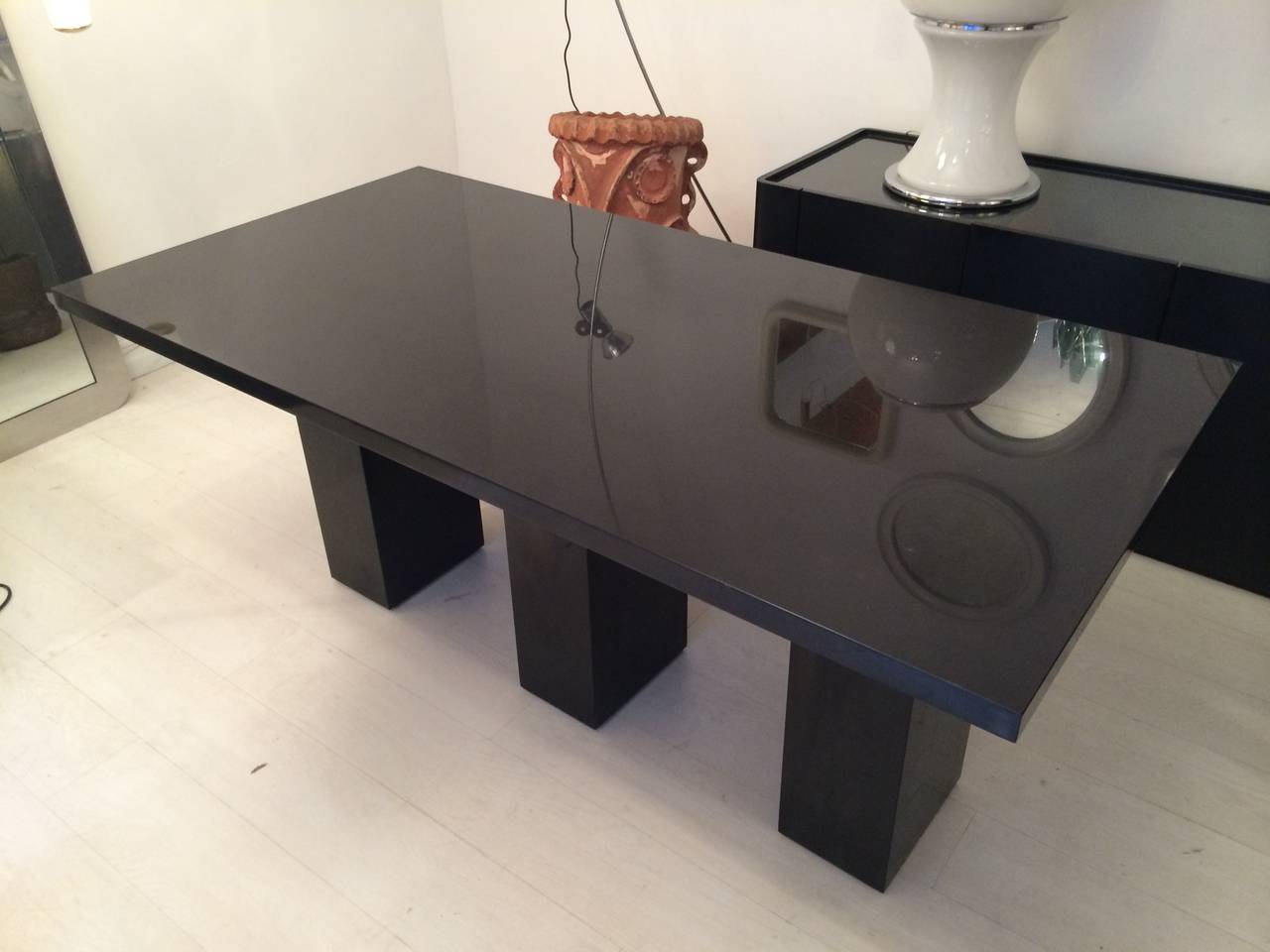 Important table in massive absolute black marble with 3 feet in massive marble. 
Minimalist and elegant italian work circa 1970. 
Dimensions : 
L : 180cm
D : 90cm
H : 80cm 
Thickness of the board : 4cm