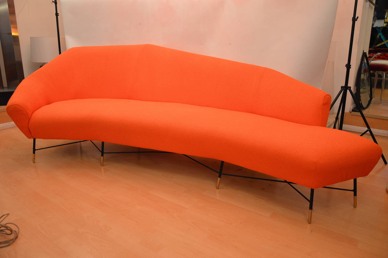 Impressive architectural sofa designed by Augusto Bozzi for Saporiti Italia. Orange cotton jersey and feet in brass painted in black on the three quarters. 
Mattress foams and jersey cotton redone like the original canapé. 
Measures: 
L max: