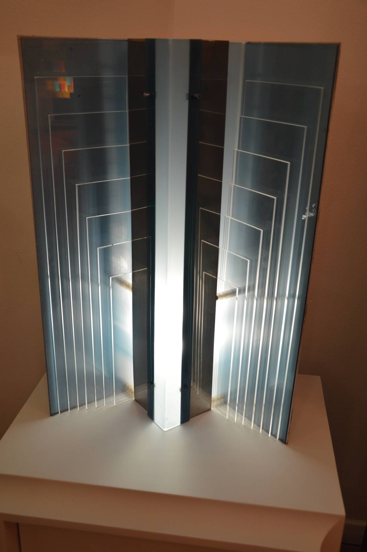 Modernist table lamp in form of building in steel and plexiglas. 
French work from the 70's. 
Measures : 
H : 60cm 
L : 41cm 
D : 20cm