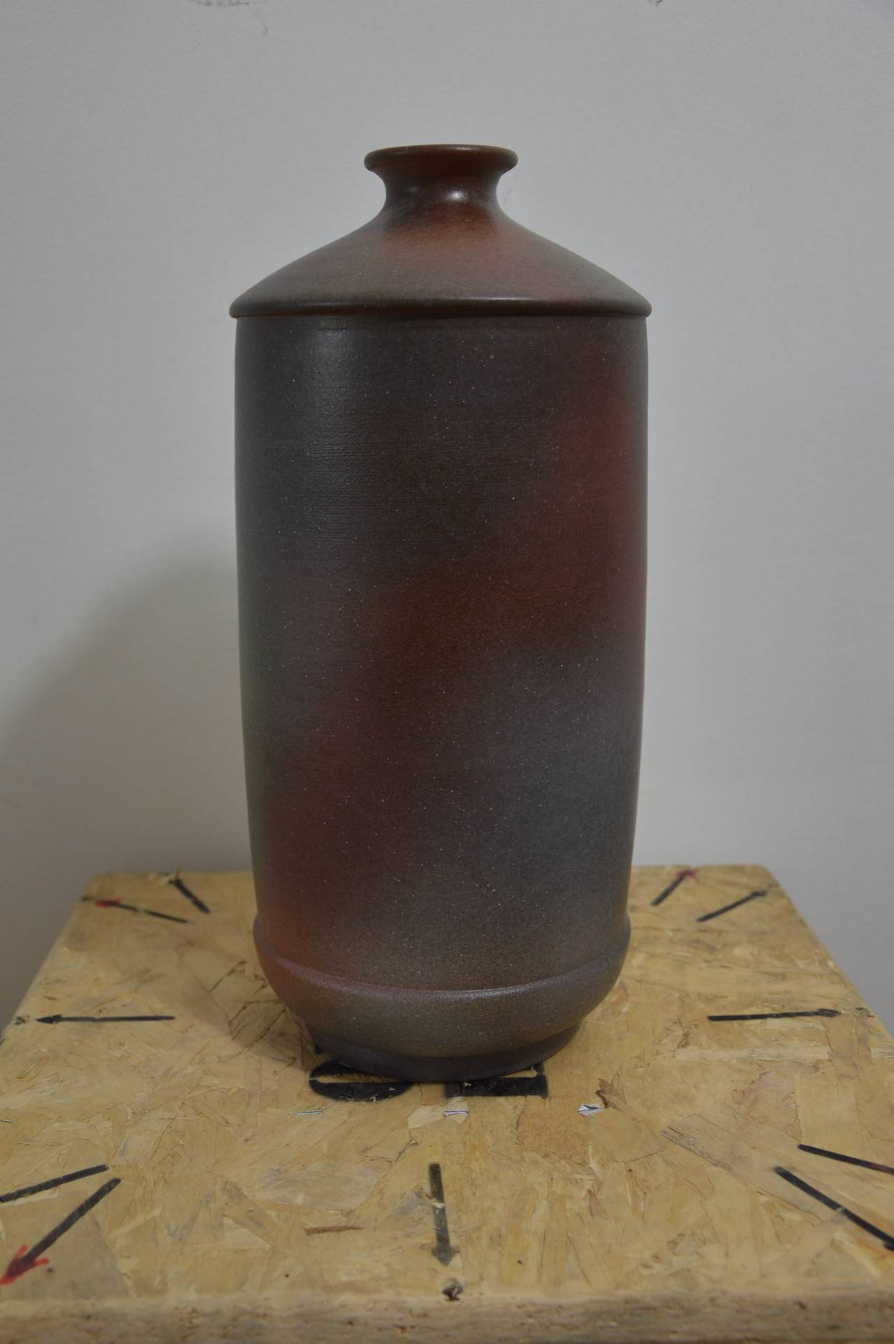 Vase in ceramic in shape of a bottle by Bitossi, colored black, red, green, like the cosmos. 
Limited edition of 99, numbered 019/99. Signed on the bottom. 
Measures :  H : 41cm  Diameter max : 18cm  Diameter of the top : 6,5cm
