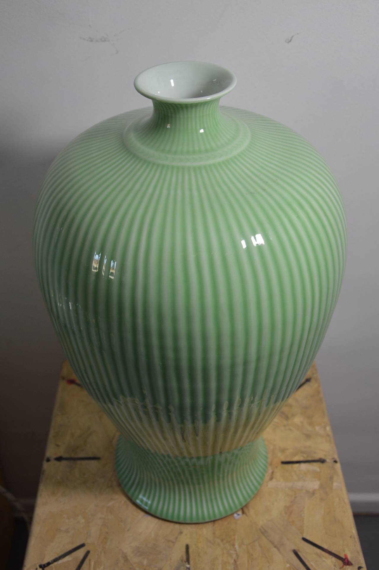 Important vase in pale green ceramic. Shape like an hydric greek vase. 
Measures :  H : 48cm  Diameter max : 30cm  Diameter of the base : 20cm