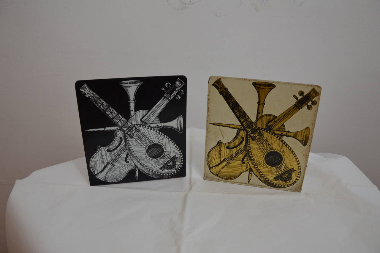 Pair of bookends by Piero Fornasetti in steel painted by hand