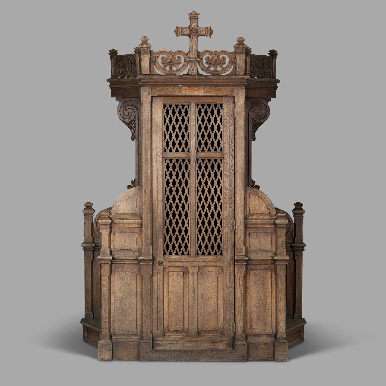 Very nice time patina for this impressive confessional of three meters height and more than two meters wide. Nothing is missing on the inside bench from the sliding traps through the small blackened wood crosses.