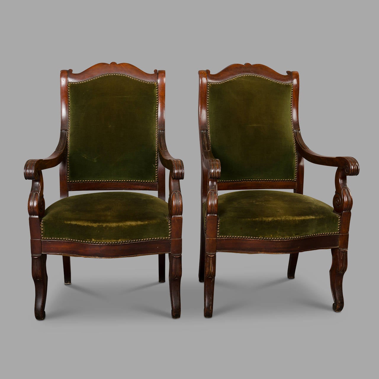 Louis-Philippe period and style armchairs in solid mahogany covered with green velvet fabric. Very good overall condition.