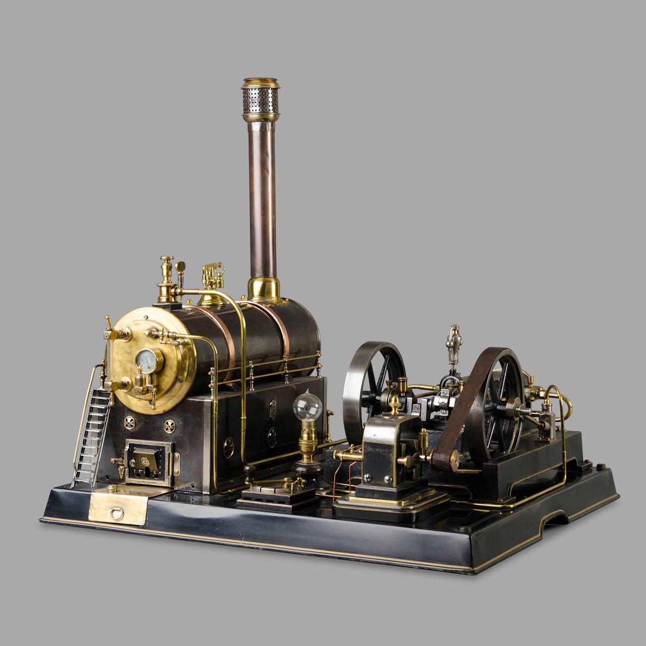 Outstanding steam engine toy manufactured by the German Märklin Company, 1890.

Cast iron, brass and blued steel. Undoubtedly the most beautiful toy built by this famous German firm. One of the few models of this quality currently known. Valve