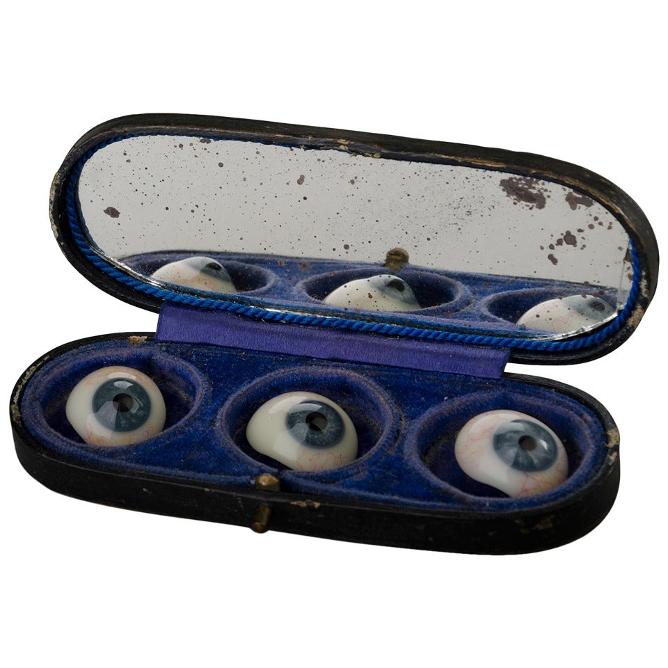Three Glass Eyes in their Storage Box
