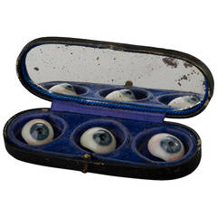 Three Glass Eyes in their Storage Box
