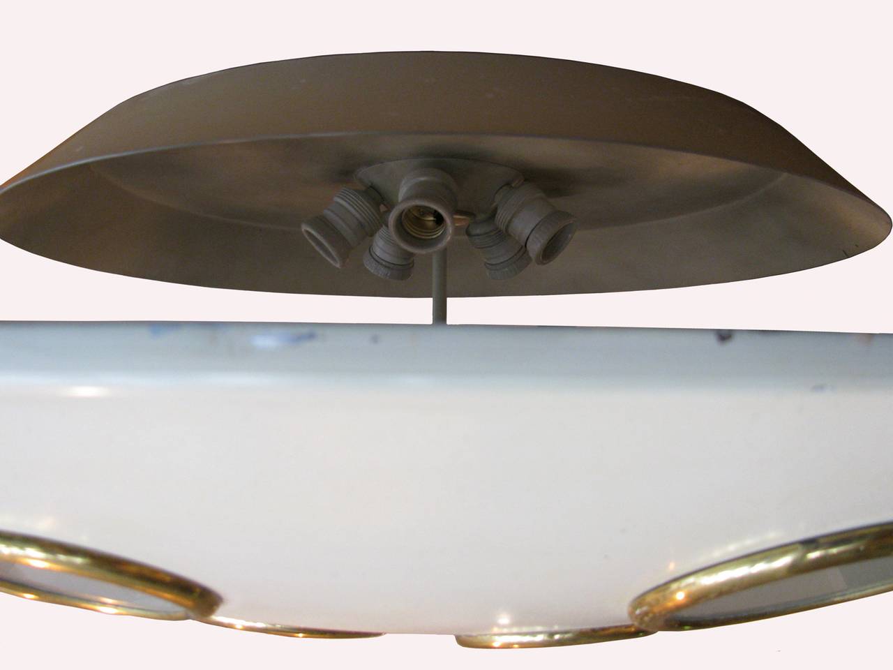 A rare pair of five-light ceiling lamps by Italian manufacturer Lumen produced in the 1950s.