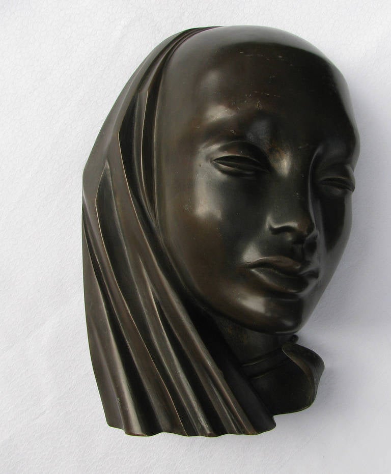 This bronze head of an African woman was made in the Hagenauer Werkstatte in Vienna in the 1930s. it is signed on the bottom Hagenauer Wien and WHW.