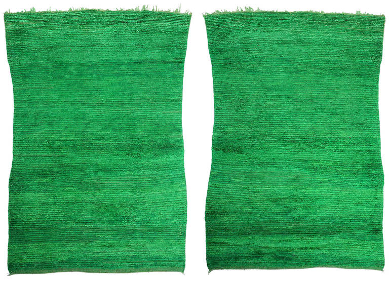 This rug is not only rare because of its double-sided appearance but also because of its color. Green is the holy color of Islam. Therefore there are hardly any authentic monochrome green rugs around. This wonderful double-sided carpet is an