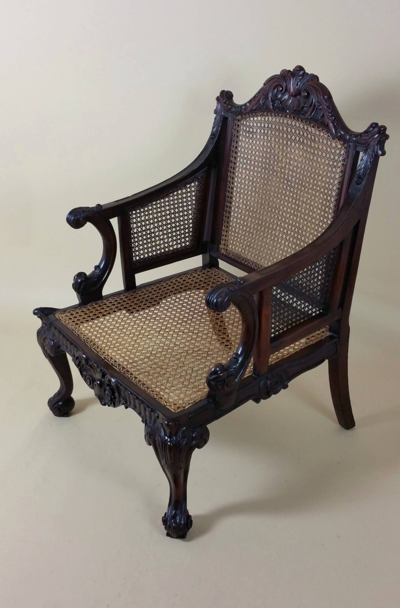 Cane Pair of 19th Century Georgian Style Carved Mahogany Library Chairs