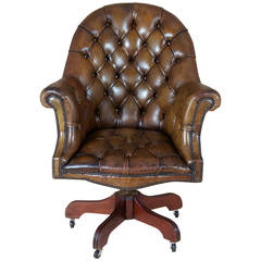 Mid 20th c. Buttoned Leather Revolving Armchair