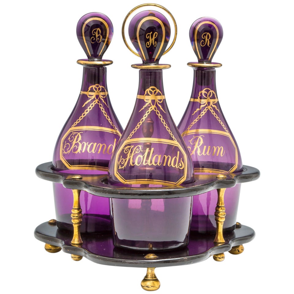 Rare Set of Three Georgian Amethyst Decanters In Black Laquered Stand