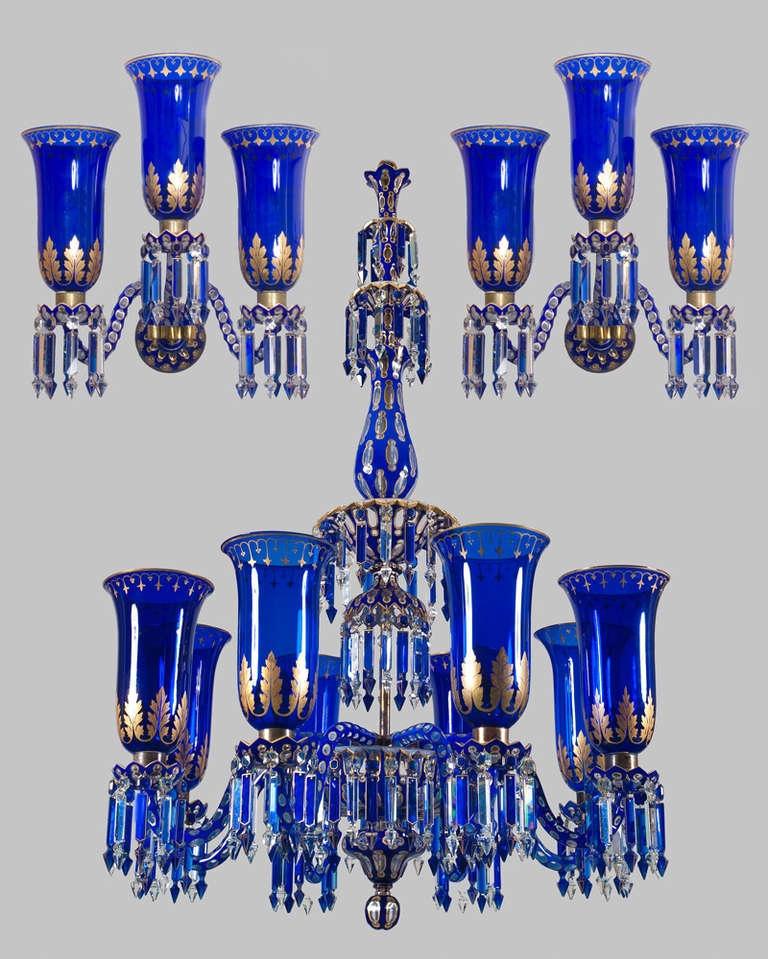 A magnificent eight light mid-Victorian blue cut glass overlaid chandelier with gilt decoration.The baluster thumb cut stem with fountain and trumpet shaped pieces the lower turnover container terminating with finial. The main arm plate supporting