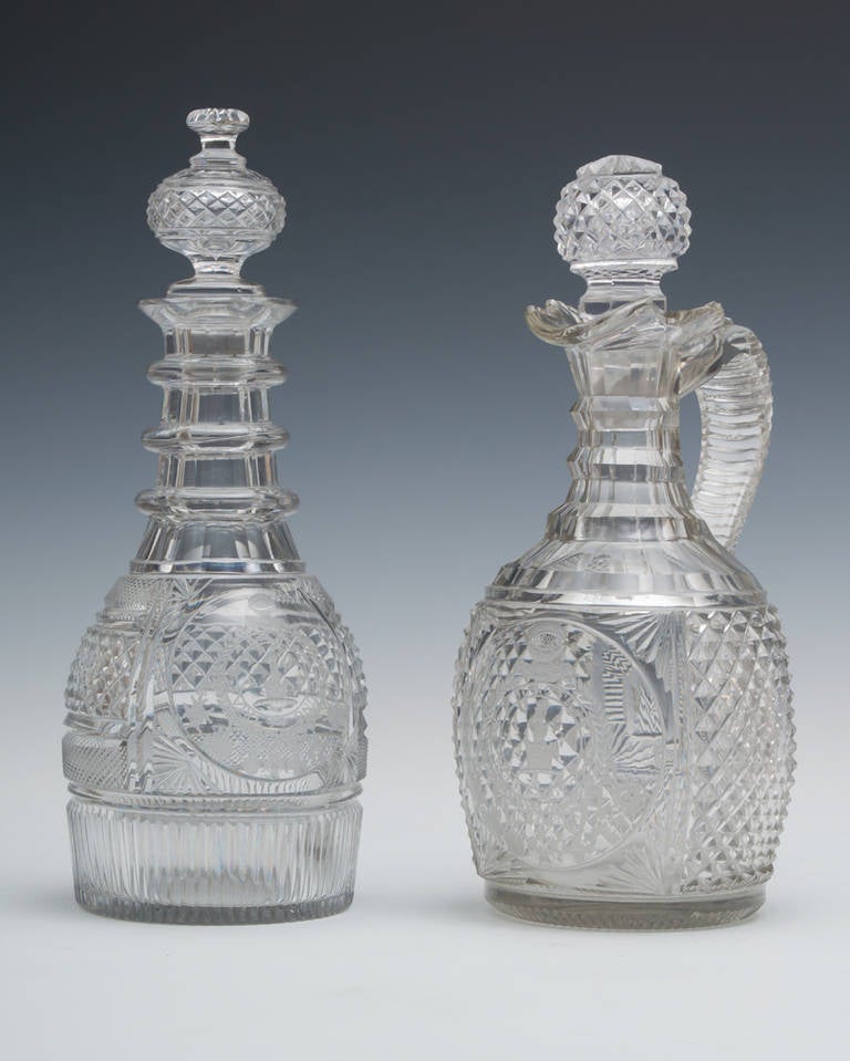 An Exceptional diamond cut regency decanter with the finest engraving with matching diamond cut Claret jug.
 
The panels engraved: 